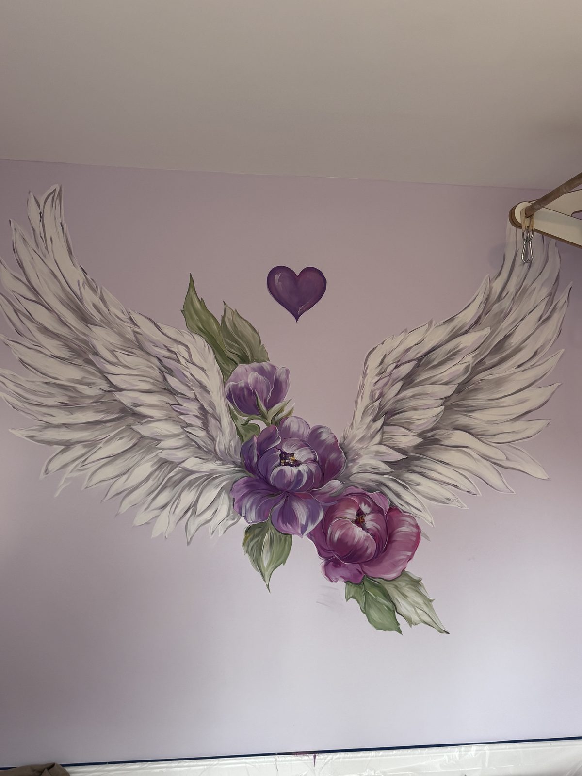 Angel wings with peonies mural