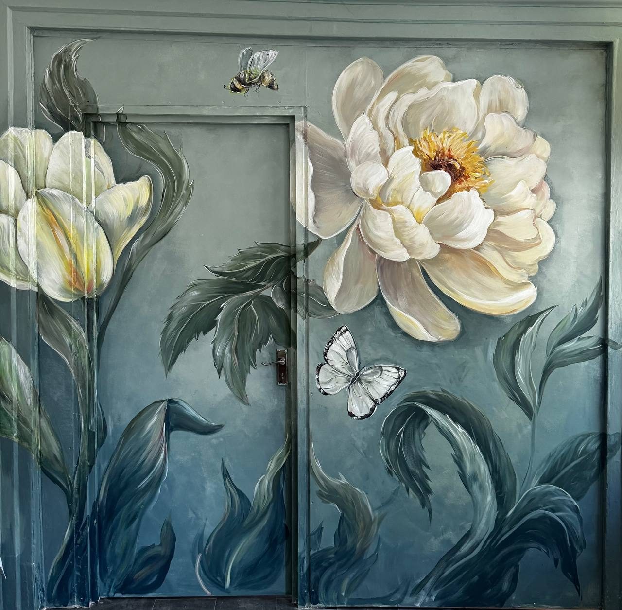 Peony wall mural painted across a door and wall